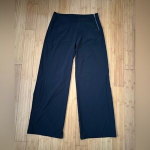 Women’s Athleta long pants with snap bottoms black size 8